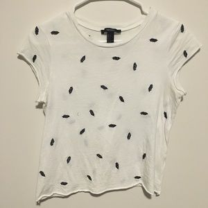 White T-shirt with black embroidered feathers